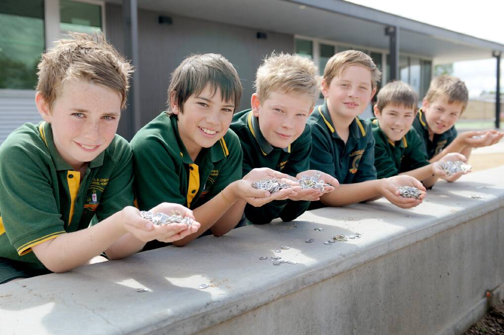 Ss Michael and John's Primary School pupils Wade Francis, Lochie Hadley, Riley Bryan, Brayden Gebert, Alex Goldsmith and Jack Butler, with some of the lids they have collected for their sustainability project. Picture: CAMANTHA CAMARRI