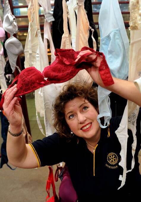 Horsham East Rotary Club president Pam Capstick with one of the 1121 bras donated at Horsham Plaza as part of Project Uplift. Picture: PAUL CARRACHER