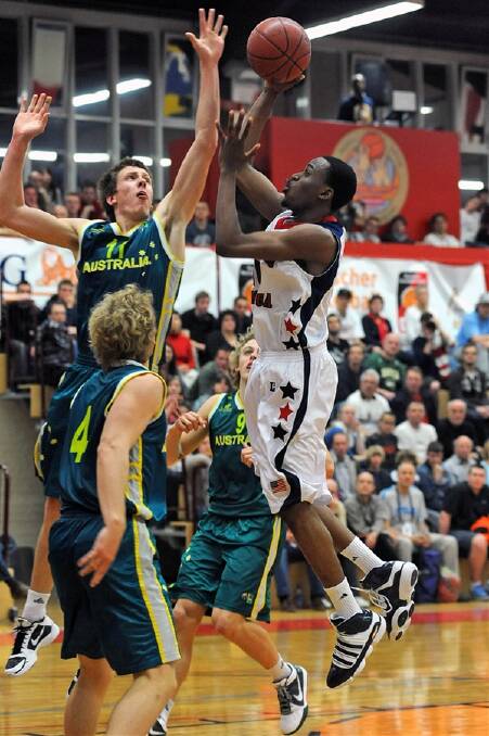 STAR: Horsham basketballer Mitch Creek won the most valuable player award at the Albert Schweitzer basketball tournament in Germany this week. He starred against the United states on Friday, jumping high here to block a shot from USA forward Kevin Ware. Picture: MICHAEL ABRAMS, STARS AND STRIPES