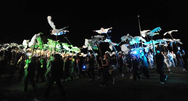 SPECTACULAR FINALE: Strange Fruit  performers hover above Wimmera primary school students and other dancers at the end of the Art is... aeiral performance 'Flock' telling the story of corellas in the Wimmera. Pictures: KATE HEALY
