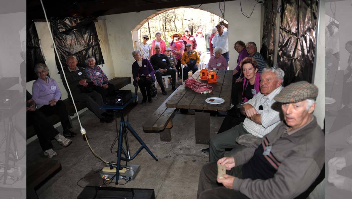Visitors watch old films at 100th birthday of Zumsteins. 