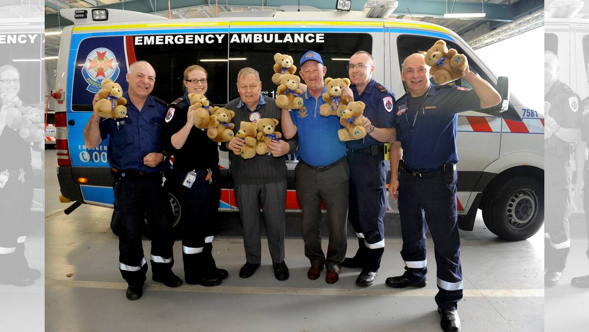 SMILE AIDS: Ambulance Victoria’s Tom McLean and Kylie Yapp, Horsham City Lions Club president Bill Deleeuw and publicity officer Don Johns, and Ambulance Victoria’s Alan Eade and Nick Thresher with 10 trauma bears. Picture: SAMANTHA CAMARRI
