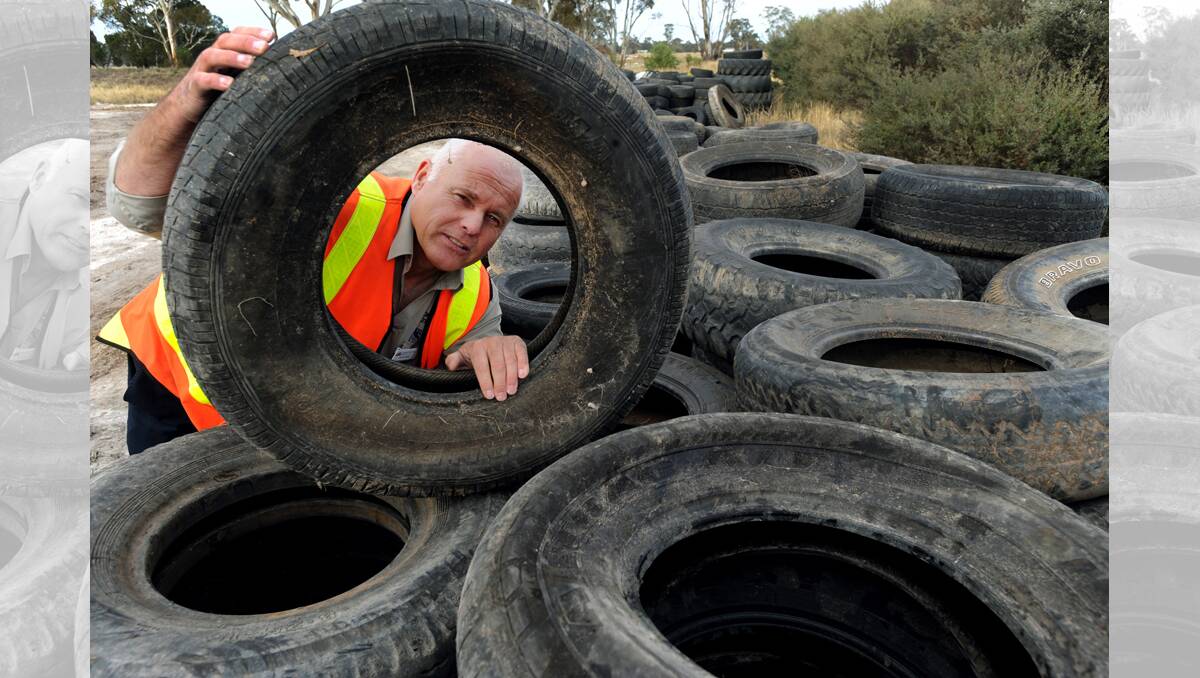 DUMPED: Horsham Rural City Council waste management supervisor Kelvin Howe with some of the tyres dumped in Horsham and at Lower Norton. Picture: PAUL CARRACHER