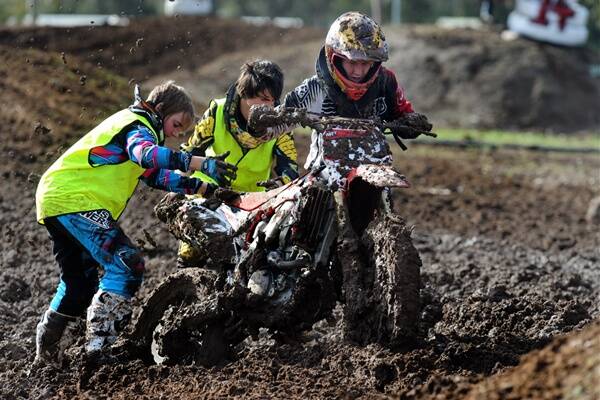 Nat Gerrish, Goulburn Valley, gets help from Jacob Williams and Alec Sudholz after getting bogged at Dooen during Victorian Senior MX championships. 