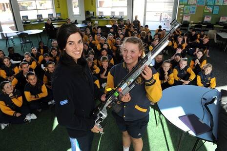 Alethea Sedgman, 2012 Olympian, at Horsham West PS speaking to students. Showing Brittany Baker her rifle.
